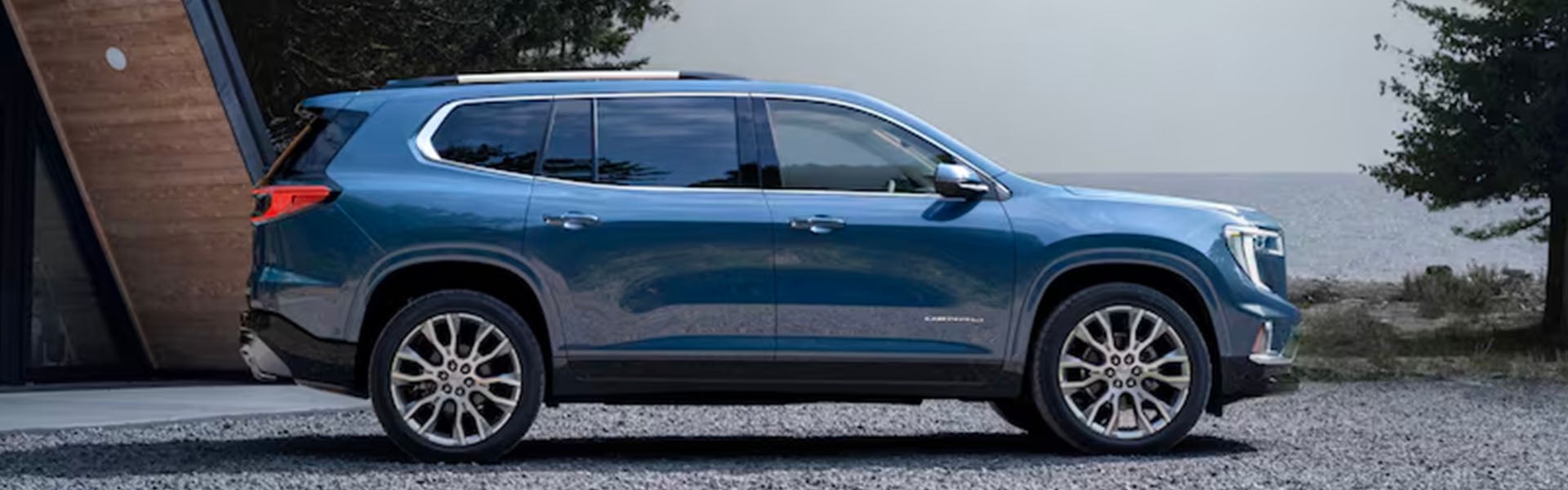 A blue suv sitting parked.