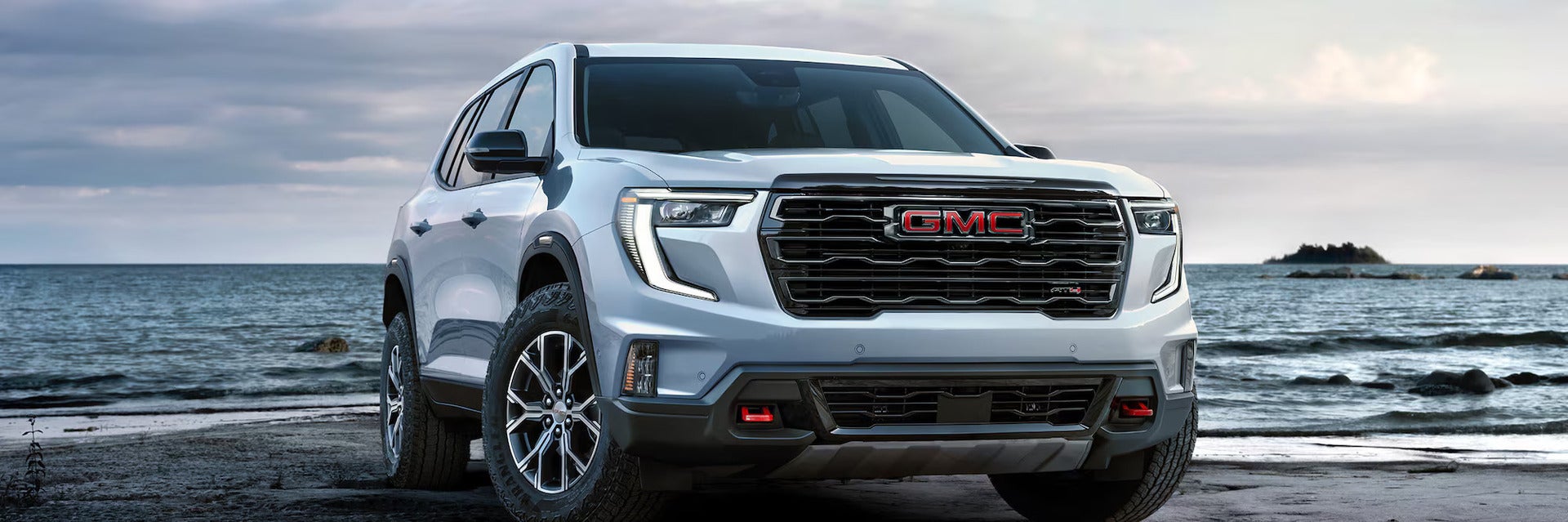 A white suv sitting parked.