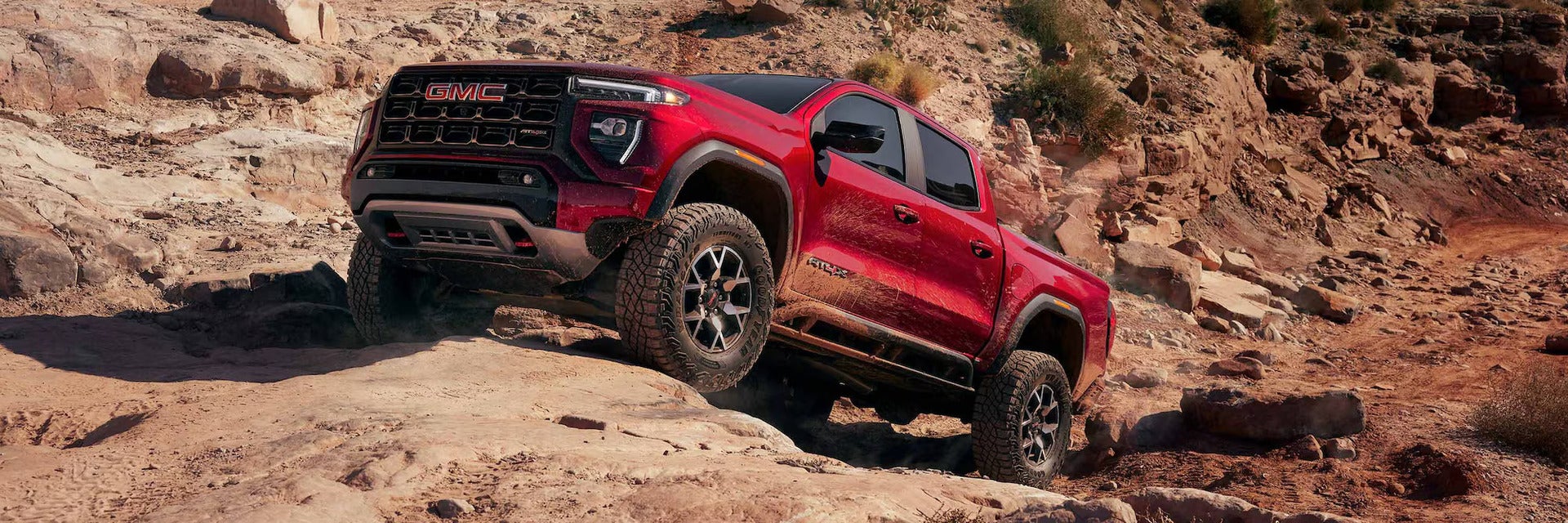 2026 GMC Canyon driving in the desert
